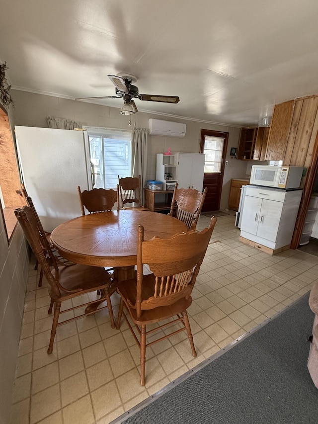 755 Bright Water Dr, Coldwater, MI 49036 - dining room with a wall mounted air conditioner, ceiling fan, and crown molding