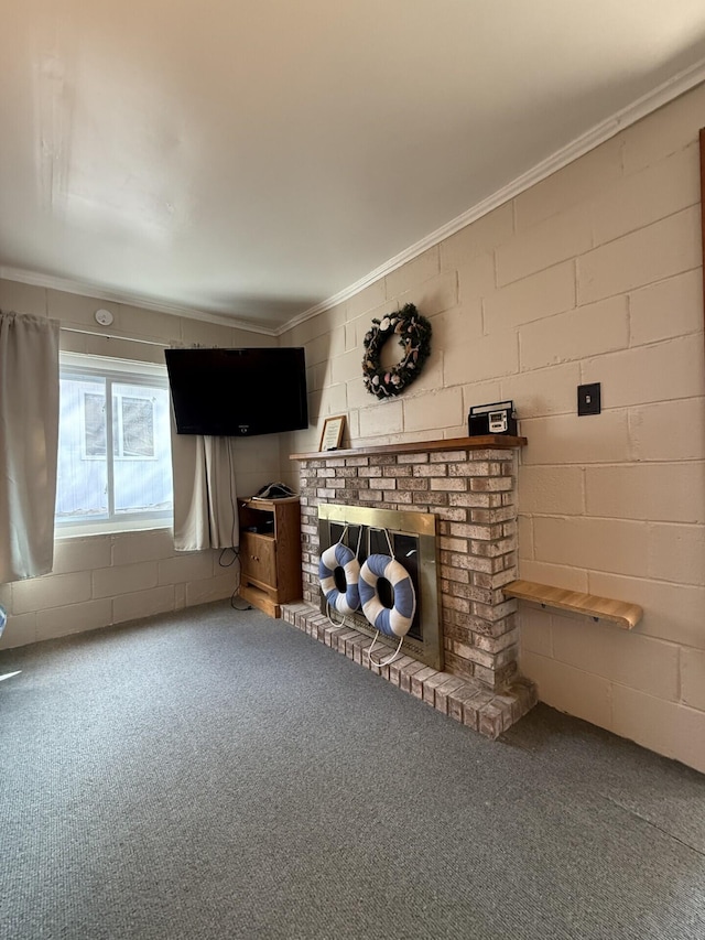 755 Bright Water Dr, Coldwater, MI 49036 - living room featuring carpet flooring, crown molding, a brick fireplace, and concrete block wall