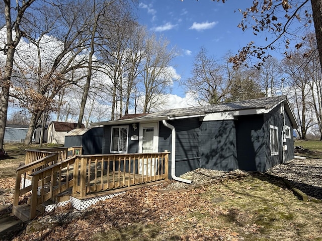 755 Bright Water Dr, Coldwater, MI 49036 - rear view of house with a deck and concrete block siding