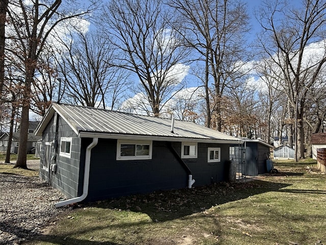 755 Bright Water Dr, Coldwater, MI 49036 - view of side of home with concrete block siding and metal roof
