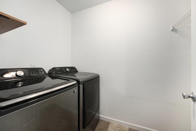 14750 Waypoint Pkwy, West Olive, MI 49460 - laundry area featuring separate washer and dryer and baseboards