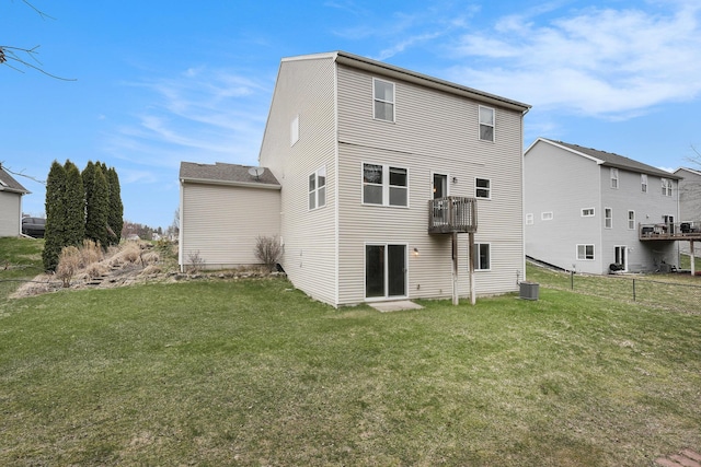 14750 Waypoint Pkwy, West Olive, MI 49460 - rear view of house featuring central AC, a yard, and a balcony