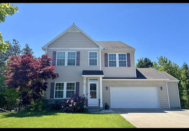 14750 Waypoint Pkwy, West Olive, MI 49460 - view of front of house with concrete driveway, a front yard, and a shingled roof