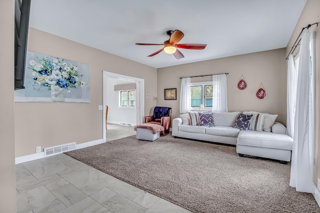 1856 N 56th Ave, Mears, MI 49436 - living room with a ceiling fan and marble finish floors
