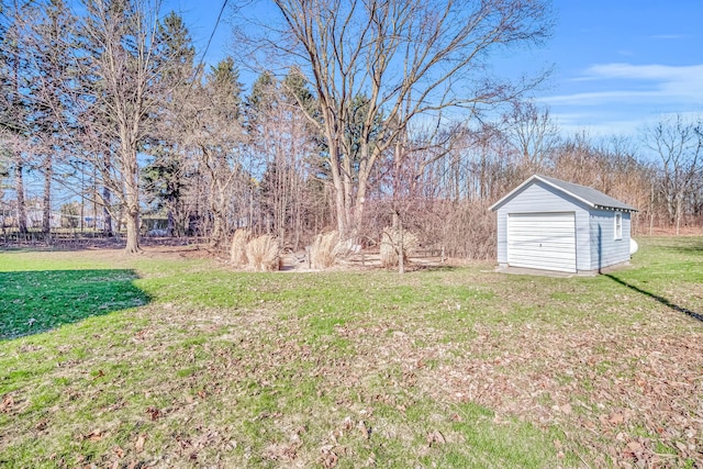 1856 N 56th Ave, Mears, MI 49436 - view of green lawn featuring a shed and a detached garage