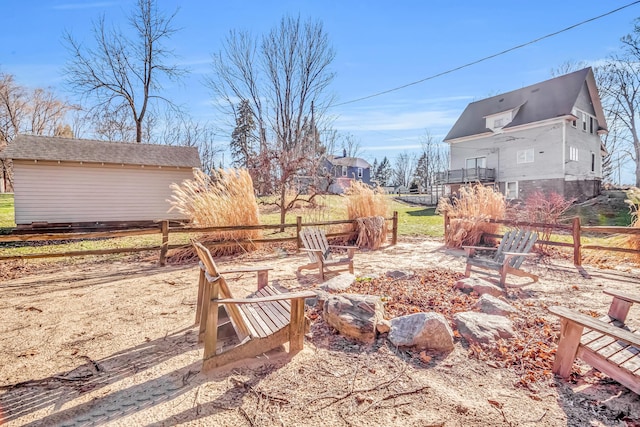 1856 N 56th Ave, Mears, MI 49436 - view of yard with an outdoor fire pit
