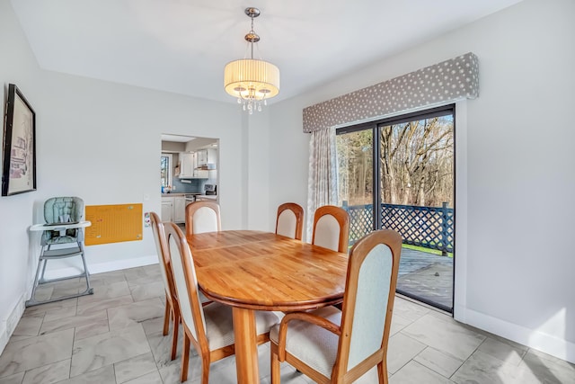 1856 N 56th Ave, Mears, MI 49436 - dining space with light marble finish floors and a chandelier
