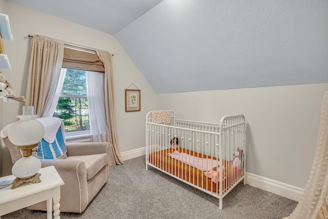 1856 N 56th Ave, Mears, MI 49436 - bedroom featuring vaulted ceiling, a nursery area, and carpet floors