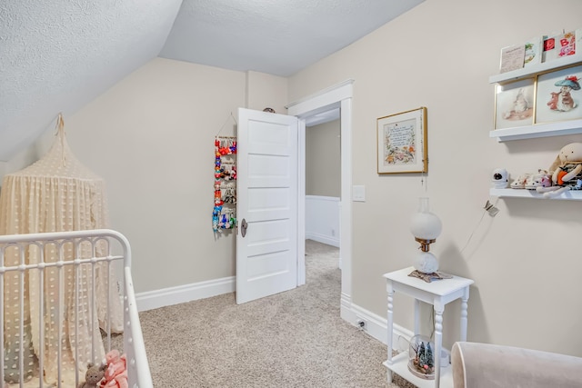 1856 N 56th Ave, Mears, MI 49436 - bedroom with vaulted ceiling, carpet flooring, and a textured ceiling