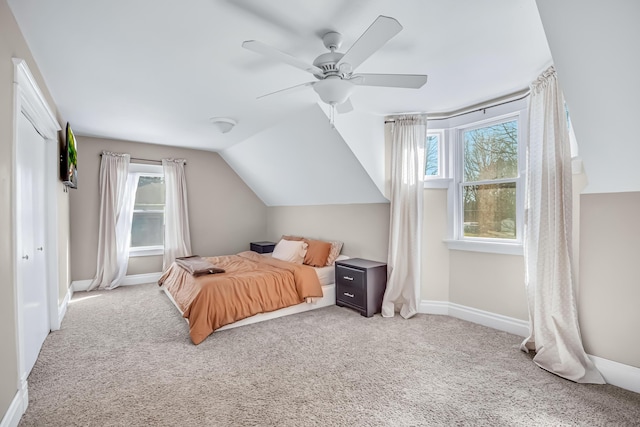1856 N 56th Ave, Mears, MI 49436 - bedroom featuring multiple windows, carpet, ceiling fan, and lofted ceiling