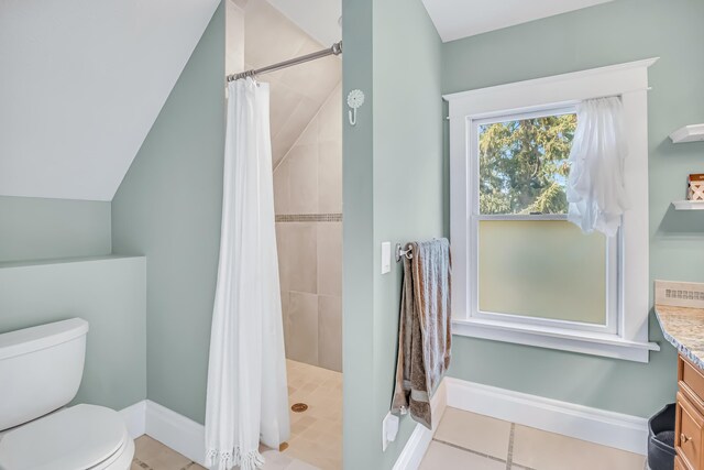 1856 N 56th Ave, Mears, MI 49436 - full bathroom with vanity, a tile shower, and vaulted ceiling