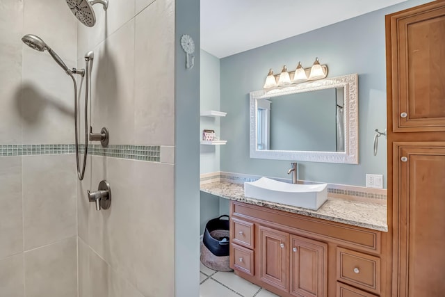 1856 N 56th Ave, Mears, MI 49436 - full bath featuring a tile shower, vanity, and tile patterned flooring