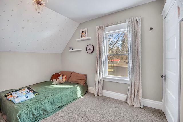 1856 N 56th Ave, Mears, MI 49436 - carpeted bedroom with lofted ceiling and baseboards