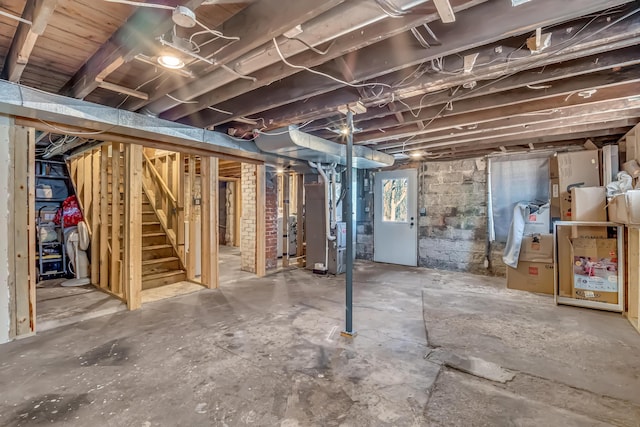 1856 N 56th Ave, Mears, MI 49436 - basement with heating unit and stairway