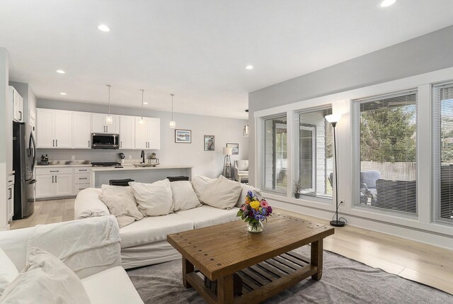 2128 Sampson Ave, Muskegon, MI 49441 - living room with light wood-style floors and recessed lighting