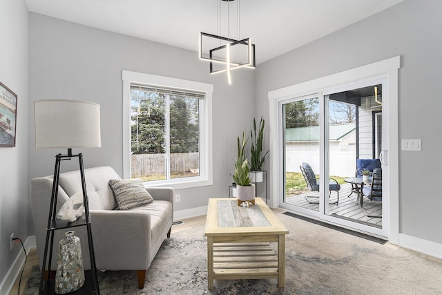 2128 Sampson Ave, Muskegon, MI 49441 - living area with healthy amount of natural light and a chandelier