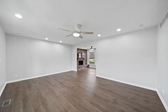 empty room with baseboards, visible vents, recessed lighting, a ceiling fan, and dark wood-type flooring