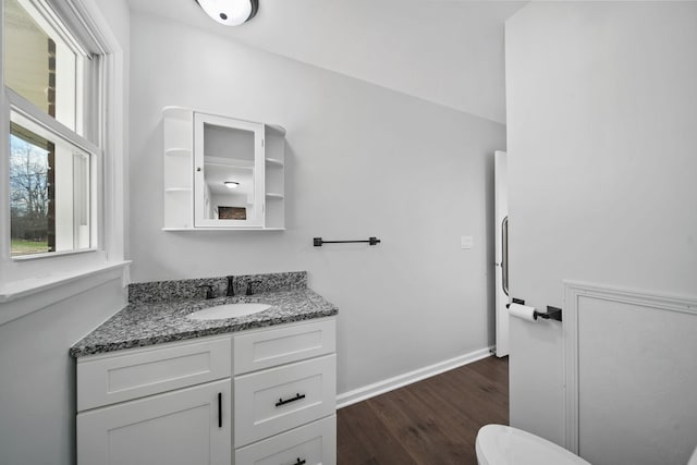 bathroom with vanity and wood finished floors