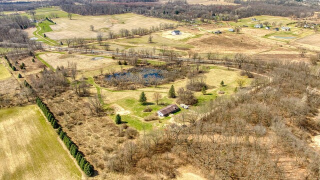 birds eye view of property featuring a rural view