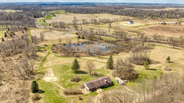aerial view with a rural view and a water view
