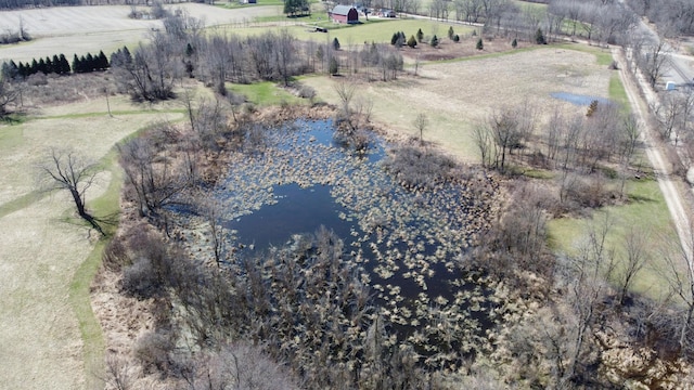 drone / aerial view featuring a water view and a rural view