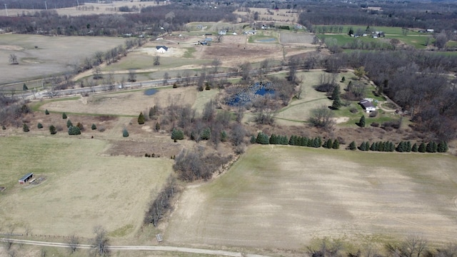 birds eye view of property featuring a rural view