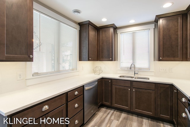 920 W Savidge St Unit 14, Spring Lake, MI 49456 - kitchen featuring dishwasher, dark brown cabinetry, backsplash, light wood-style floors, and recessed lighting