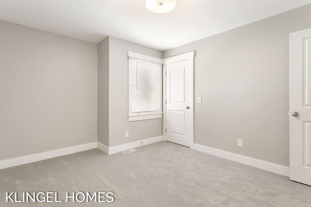 920 W Savidge St Unit 14, Spring Lake, MI 49456 - unfurnished bedroom featuring light carpet and baseboards