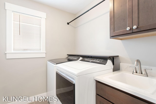 920 W Savidge St Unit 14, Spring Lake, MI 49456 - laundry room featuring washing machine and dryer and cabinet space