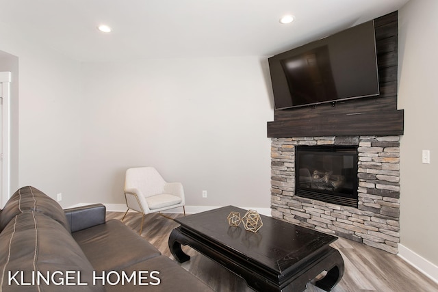 920 W Savidge St Unit 14, Spring Lake, MI 49456 - living room with wood finished floors, recessed lighting, and a stone fireplace