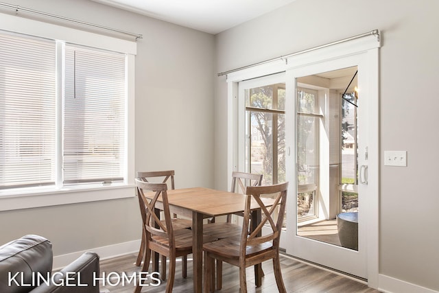 920 W Savidge St Unit 14, Spring Lake, MI 49456 - dining room featuring wood finished floors and baseboards