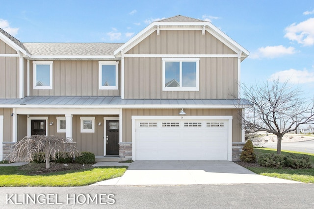 920 W Savidge St Unit 14, Spring Lake, MI 49456 - view of front of property with roof with shingles, stone siding, and a metal roof