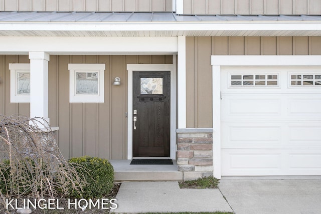 920 W Savidge St Unit 14, Spring Lake, MI 49456 - entrance to property with board and batten siding and a garage