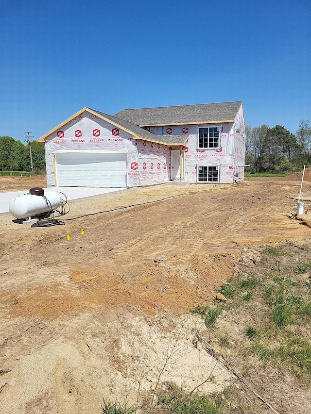 560 Needlewood Dr, Cedar Springs, MI 49319 - property in mid-construction with an attached garage and concrete driveway
