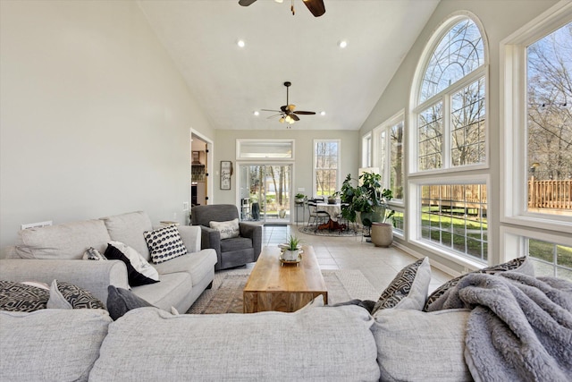 7101 River Glen Dr, Caledonia, MI 49316 - living area featuring high vaulted ceiling, a ceiling fan, and a healthy amount of sunlight