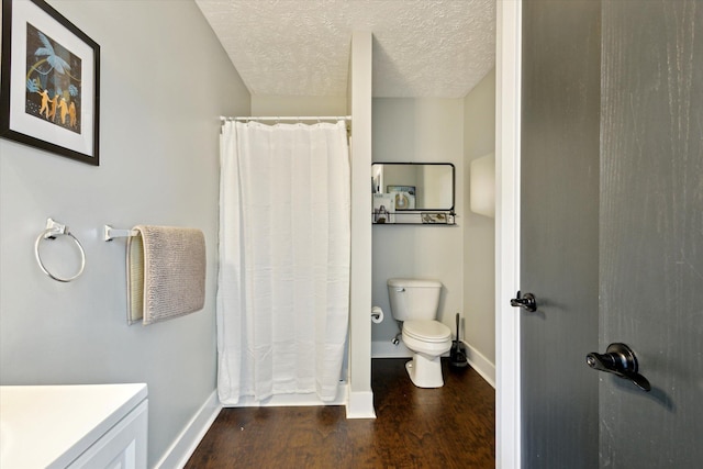 7101 River Glen Dr, Caledonia, MI 49316 - bathroom featuring a shower with shower curtain, baseboards, toilet, and wood finished floors