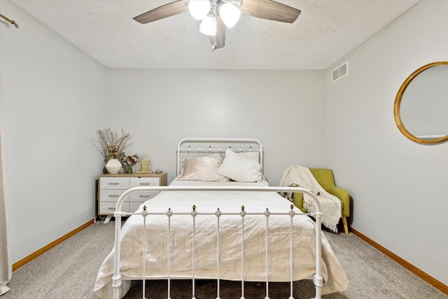 7101 River Glen Dr, Caledonia, MI 49316 - carpeted bedroom with visible vents, baseboards, ceiling fan, and a textured ceiling