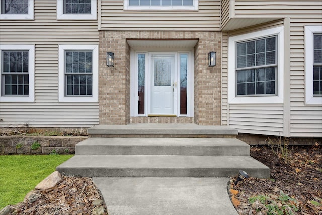 7101 River Glen Dr, Caledonia, MI 49316 - view of exterior entry featuring brick siding