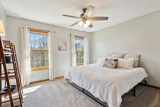 7101 River Glen Dr, Caledonia, MI 49316 - bedroom featuring carpet flooring, baseboards, a textured ceiling, and ceiling fan