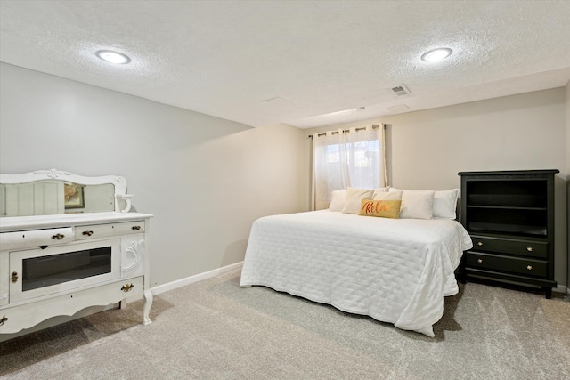 7101 River Glen Dr, Caledonia, MI 49316 - bedroom featuring carpet flooring, visible vents, a textured ceiling, and baseboards