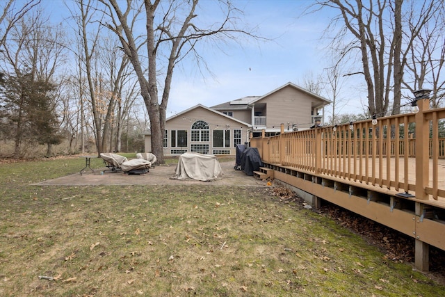 7101 River Glen Dr, Caledonia, MI 49316 - rear view of house featuring a yard, a patio area, and a wooden deck