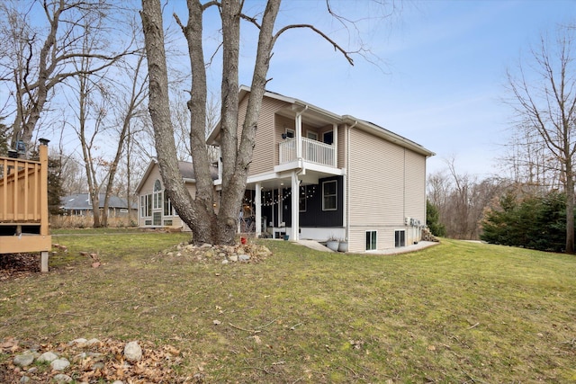 7101 River Glen Dr, Caledonia, MI 49316 - rear view of house featuring a lawn and a balcony
