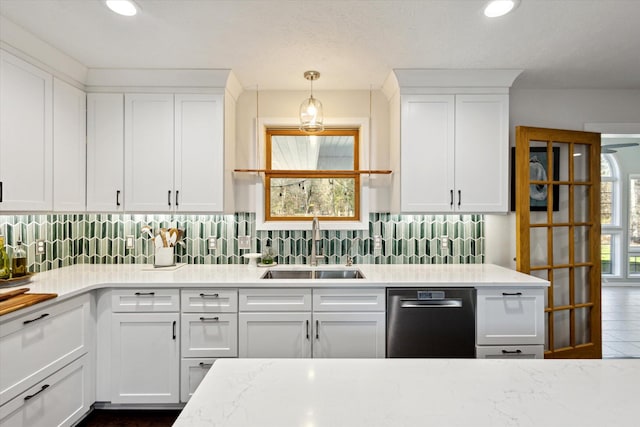 7101 River Glen Dr, Caledonia, MI 49316 - kitchen with a sink, decorative backsplash, white cabinetry, and dishwasher