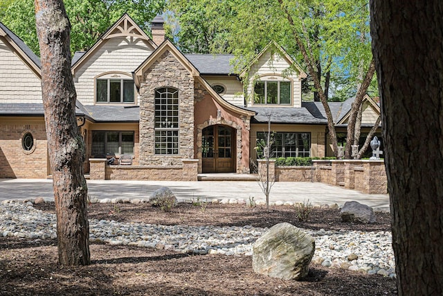 2891 Gale Rd, Ann Arbor, MI 48105 - view of front of property featuring stone siding and a chimney