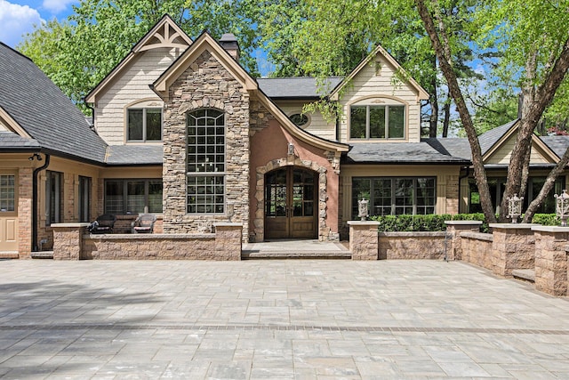 2891 Gale Rd, Ann Arbor, MI 48105 - view of front of property featuring french doors, a chimney, and stone siding