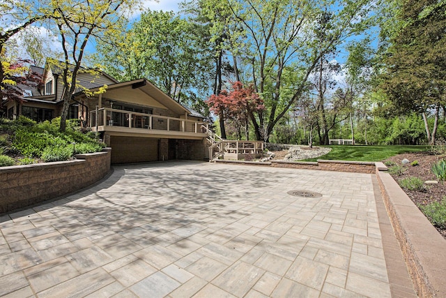 2891 Gale Rd, Ann Arbor, MI 48105 - view of patio featuring a garage and driveway