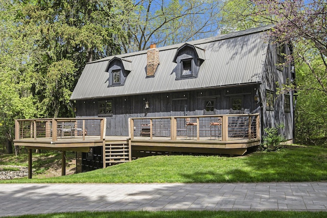 2891 Gale Rd, Ann Arbor, MI 48105 - view of front of property with metal roof, a chimney, a deck, a front yard, and stairs