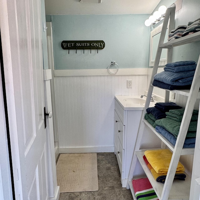 4830 Deep Point Dr, Portage, MI 49002 - bathroom with wainscoting and vanity