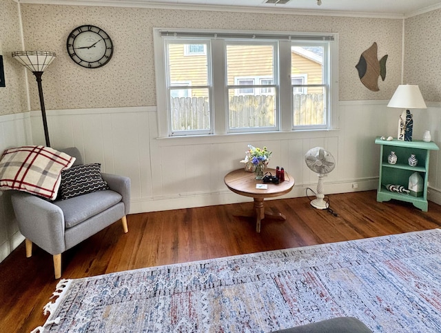 4830 Deep Point Dr, Portage, MI 49002 - living area with wainscoting, wood finished floors, healthy amount of natural light, wallpapered walls, and ornamental molding
