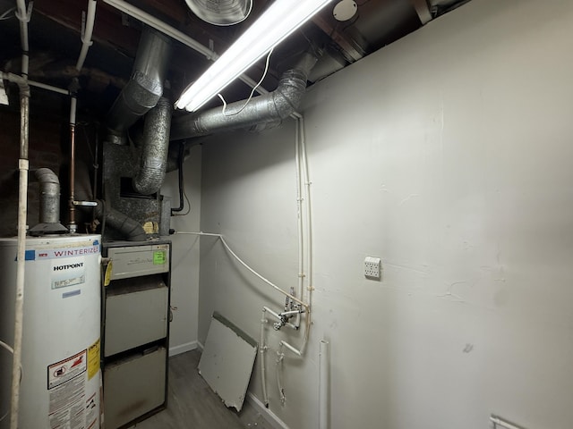 utility room featuring gas water heater
